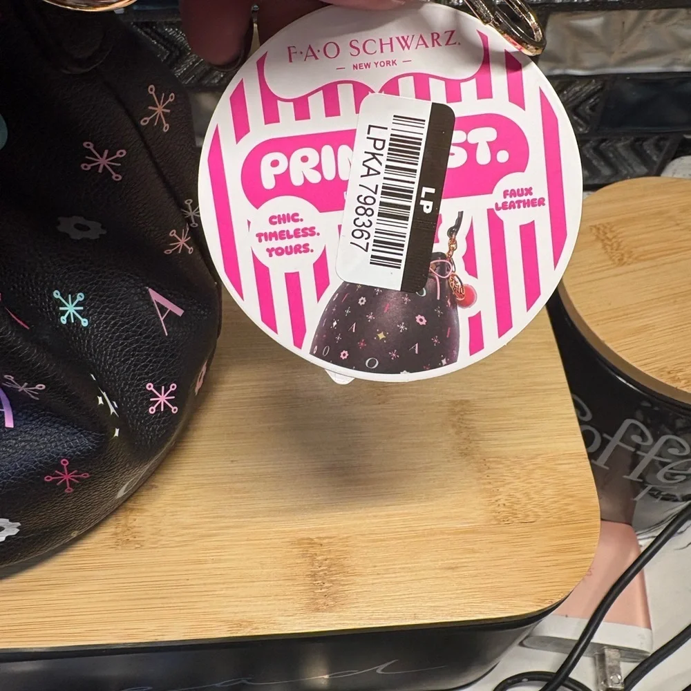 FAO Schwarz Black Drawstring Bucket Bag with Pink Trim and Multicolor Accents